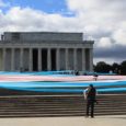 Local activists joined forces with the National Center for Transgender Equality to pull off an amazing display of defiance. They unfurled a 150-foot trans flag on the steps of the Lincoln […]