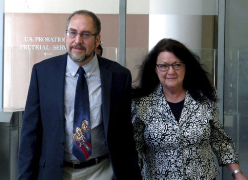 Philip Zodhiates and a woman leaving a building